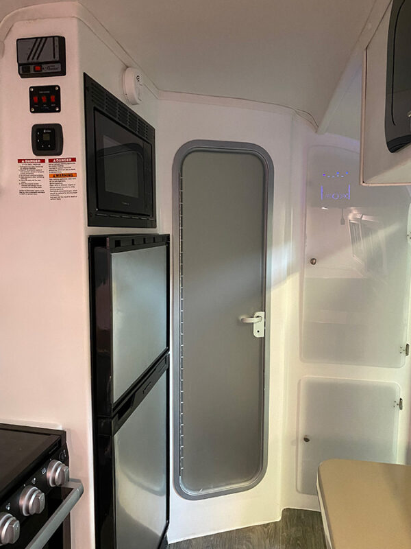 white cortes camper interior with door