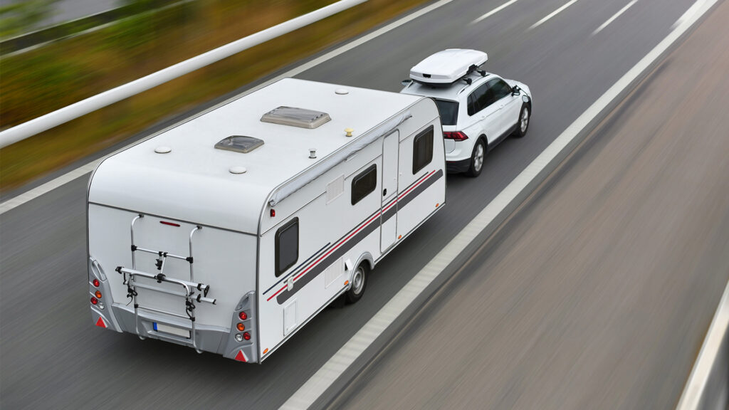 Smarter Tires Systems for Safer Travel white trailer on road