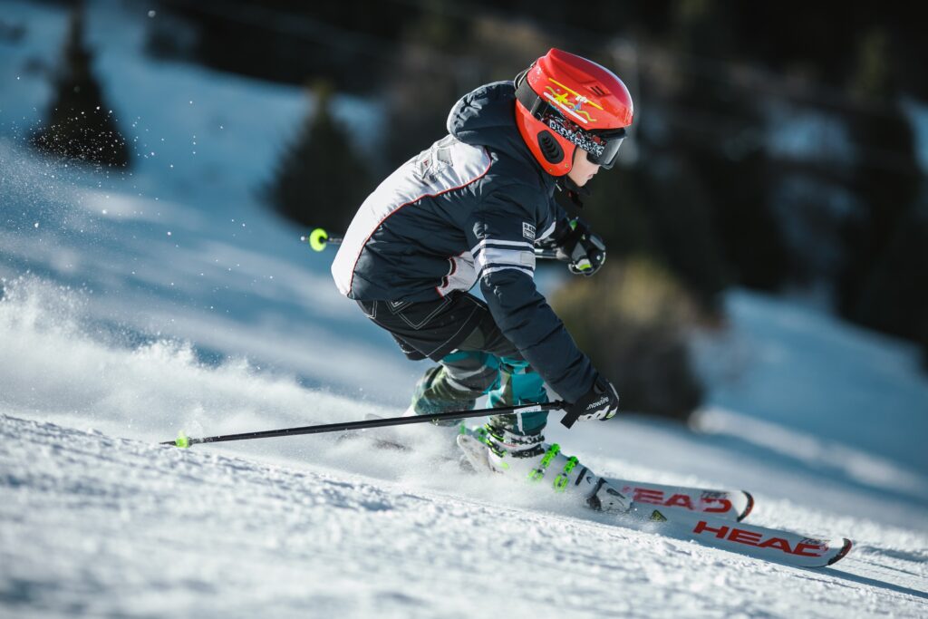 A woman skiing with the best ski gloves of 2023